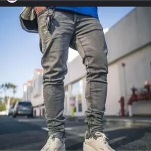Mnml Relaxed tapered Jean with side ankle zippers stacked